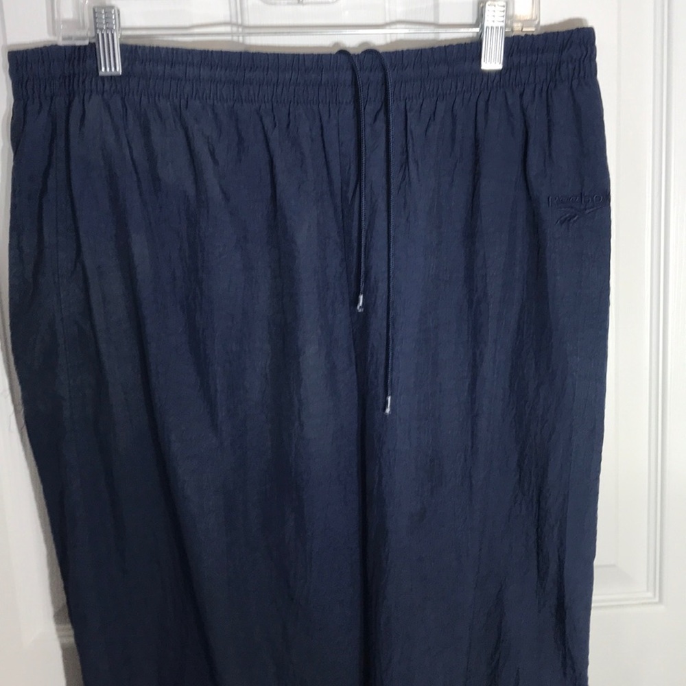 Navy reebok sweat pants with zipper cuff bottoms